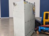 an image of a refrigerator in a room with a blue wall