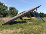 a wooden bench that is sitting in the grass