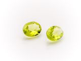 a pair of yellow sapphires on a white background