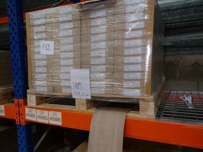 a large stack of boxes on a pallet in a warehouse