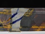 a close up of a glass with a painting on it
