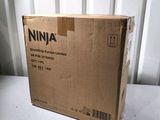 a box that is sitting on a table in front of a wall