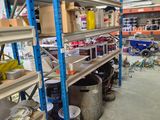 a room with a lot of shelves and buckets on it