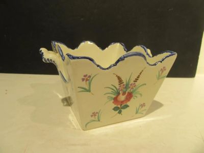 a small bowl that has a flower design on it