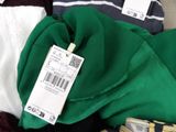 a pile of clothing with a price tag on it