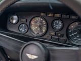 a steering wheel of a car with a clock on it