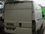 a white van that is parked in a parking lot