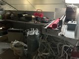a picture of a kitchen with a lot of stuff on the counter