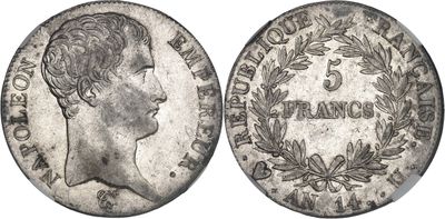 a silver coin with an image of a woman ' s head on it