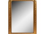 an image of a gold framed mirror on a white background