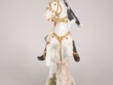 an image of a figurine of a man riding a horse