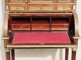 a wooden desk with a red mat on it