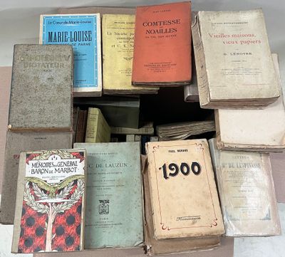 many old books stacked on top of each other on a table