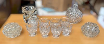 a lot of glass items sitting on a table