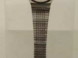 a watch that is on display in a glass case