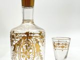 a decanter and a wine glass sitting next to each other