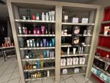 many different types of hair products on the shelves in the store