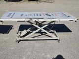 a table that is sitting in the middle of a parking lot