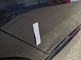 a sticker on the side of a car that has a price tag attached to it