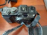 a camera on a table with a camera strap on it