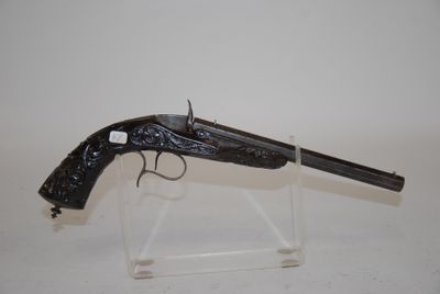 an old gun on display on a clear acrylic stand