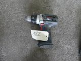 a cordless drill on the ground with a price tag