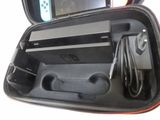 a hard case with a game controller inside of it