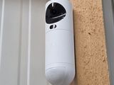 a small camera attached to the side of a building