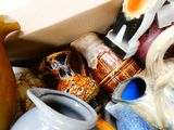 a box full of vases and other decorative items