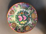 a small bowl with a design on it on a table