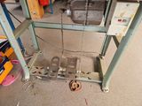 a picture of a workbench with a machine on it