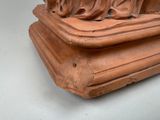a statue of a woman sitting on top of a table