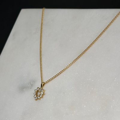 Pendentif "coeur" en or jaune 750/1000 (18K) orné de pierres…