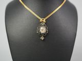 a close up of a necklace on a mannequin mannequin mannequin mannequin mannequin mannequin mannequin mannequin