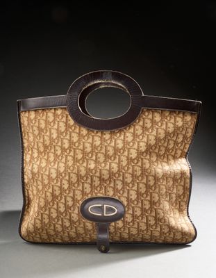 an image of a brown and black purse with a brown handle