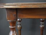 a close up of a table with a wooden top