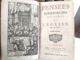 an old book with a picture of a group of people sitting at a table