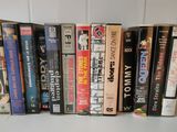 a lot of books that are on a shelf