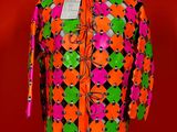a close up of a mannequin torso with a colorful shirt on it