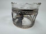 a silver cup with a picture of a woman on it