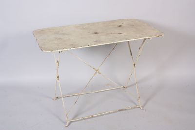 an image of a small table with a white top and legs