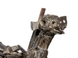 a sculpture of a dragon made out of metal and wood