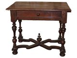 an old wooden table with a drawer on top of it