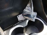 a cup holder in the center of a car ' s dashboard