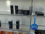 many different types of perfumes on display in a store