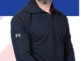 a man that is standing in front of a blue and white background