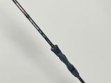 a close up of a fishing rod on a white surface