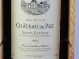 a bottle of wine in a wooden box on a table
