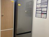 an image of a kitchen with a refrigerator and a sink