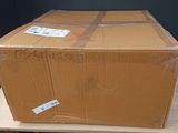 a cardboard box sitting on top of a wooden table
